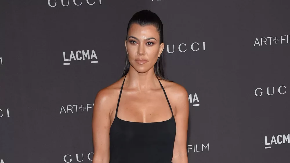 Kourtney Kardashian Announces Pregnancy With Travis Barker At Blink 182