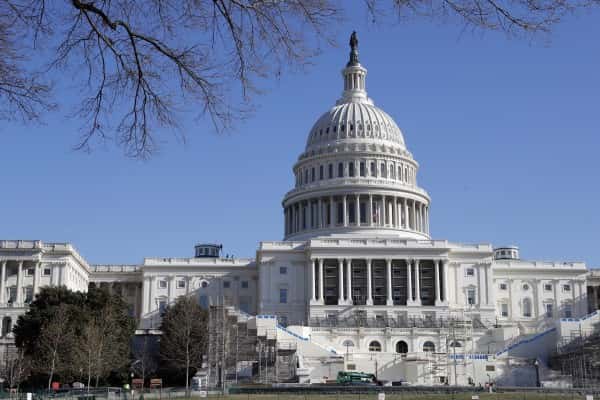 Work continues on the stand for the inauguration of President-elect Donald Trump on the West Front of the Capitol in Washington, Wednesday, Dec. 28, 2016. Trump will be sworn in at noon on Jan. 20, 2017 as America's 45th president. (AP Photo/Alex Brandon)