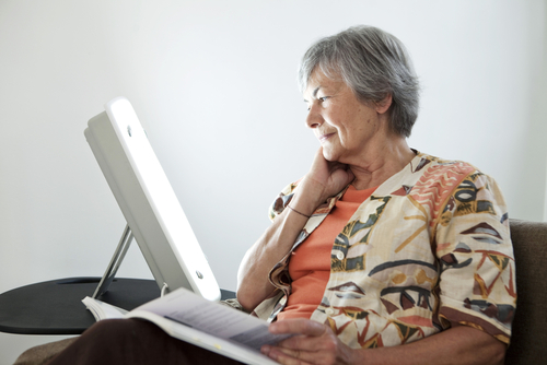 Elderly woman reading.