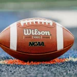 Wilson football ^ NCAA logo on playing field