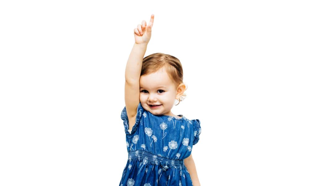 little girl raising hand to talk