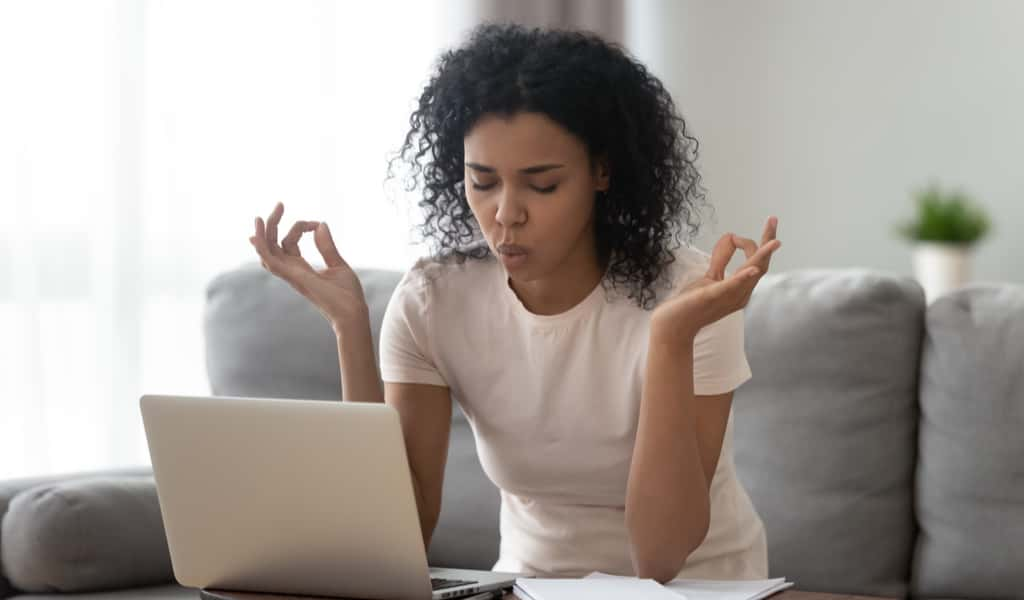 african american woman takes deep breath before responding