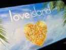 '2025 Love Island'' shown on a smart phone. is a reality dating show that originated in the UK. The premise involves a group of singles living together in a luxurious villa^ where they couple up Toronto^ Canada - June 5