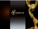 Emmys logo displayed on a smartphone screen with a blurred gold award statuette in the background^ television industry awards and digital streaming concept. Kaunas^ Lithuania - 2026 March 24