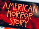 Screensaver with the 'American horror story' logo on a smartphone on toned background