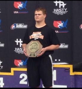 Michael Kelly of Oakes with his National Championship trophy from the USA Wrestling Cliff Keen Folkstyle National Tournament. Photo courtesy of Cole Kelly