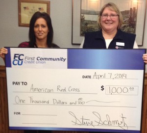 Beth Dewald Receiving The Check From Stephanie Finck. Photo courtesy of American Red Cross ND/MN