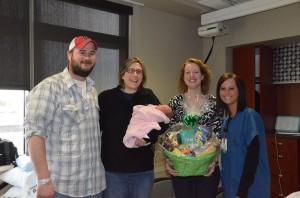 The Amann family accepting the basket. Photo courtesy of the Jamestown Regional Medical Center.