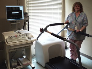 Carmen McManus, RN, Cardiac Rehab Coordinator shows the new stress test technology at Carrington Health Center.