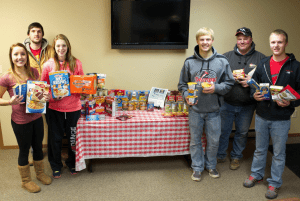 Meggan Domek, Jenna VanRay, Cole Diede, William Widmer, Ian Snow along with Jamestown Crew Foreman and PBK School District Board Member Steve Homes are pictured with some (only SOME) of the items the donated as part of Northern Plains Electric Cooperative’s #CoopMonth Can & Coat Drive. Not pictured is their teacher, Chantel Grosulak.