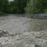 stock-footage-a-wide-angle-view-showing-a-fast-moving-and-swollen-river-after-a-flash-flood