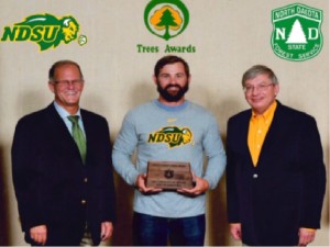 Doug Wiles receives plaque for Community of the Year. Photo courtesy of Jamestown Chamber of Commerce.