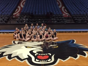 The group poses on the logo at the Target Center in Minneapolis, MN. Photo courtesy of the Jamestown Gymnastics Club.