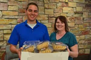 Anita Soupir and Nick Bruns bring cookies to the JRMC. Photo courtesy of the Jamestown Regional Medical Center.