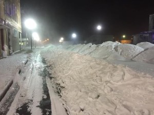 Snow amounts on Mainstreet in Carrington. The Sidewalk is visible, but the street is full of snow. Photo by Greg Grenz.