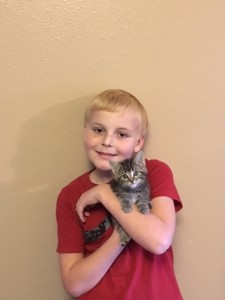 Carsten and his cat Gracee. Photo courtesy of Make-A-Wish North Dakota.