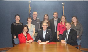 Pictured from left to right: Back: Stephanie Hoffart, Nancy Wolsky, Jeff Wolsky, Gretchen Hjelmstad, Curt Skaley, Stacey Thomas and Katie Cashman Fitzsimmons. Front: Terri Philion, Governor Doug Burgum, Rob Stotz Photo courtesy of Red Cross Association.