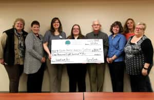 The Jamestown Community Foundation awards a grant of $1,800 to the South Central Homeless Coalition for assistance with participation in the First Link/211 hotline program.  Pictured l-r are:  Joan Morris and Becky Thatcher-Keller, Jamestown Community Foundation board members; Cassie DuBray, Pastor Susan Haukaas, Jerry Bergquist and Abbie Craig, South Central Homeless Coalition board members; Paulette Ritter, Jamestown Community Foundation board member; Sharon Smith, Coalition board member.