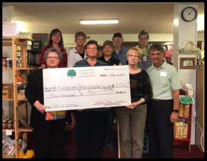 Front row:  Lorrie Pavilcek, chair of RSVP Enterprises, Deb Lee, store manager, Kelly Krein, AAUW Bookstore chair, Tim Burchill, Community Foundation board member.  Middle row:  Mary Craft, AAUW treasurer. Back row:  Toni Wegenast and Shirley Jackson, Community Foundation board members, Marlys Carter, Dakota Store volunteer, and Donna Gullickson, bookstore volunteer. Photo courtesy of the Jamestown Chamber of Commerce.