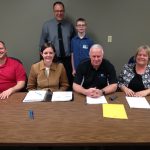 Back row l to r: Washington Principle Chad Lueck and student Aidyn McCombs who led the school board in the pledge of allegiance on April 17th. Front row l to r: Board members Ryan Mathias, Natalie Wintch, Mike Callahan and Joyce Braunagel.