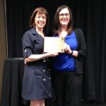 Kay Vinje present Samantha Holm the manager of Thrifty White Drug with the Community Image Award.