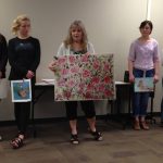 Teacher Kelly Callahan and her art students recognized for their artwork awards during a school board meeting on May 15th.