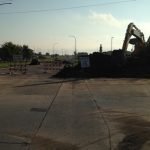 Crews installing storm sewer pipe