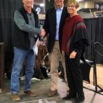 Jim & Judy: Tim Ost congratulates ND Ag Hall of Fame Inductees Jim and Judy Hauge.