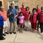 Hi Liner Award: L to R; Doreen Sayler, Larry Sayler, Larry E. Sayler, Chloe Sayler, Tracey Compson, Tyler Van Bruggen, Kay Vinje, Lori Jury, Tom Kellogg and Deb Koepplin