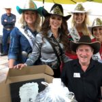 Ross Rolshoven: NDCHF board member from Grand Forks, N.D. and Rodeo Queens during the auction.