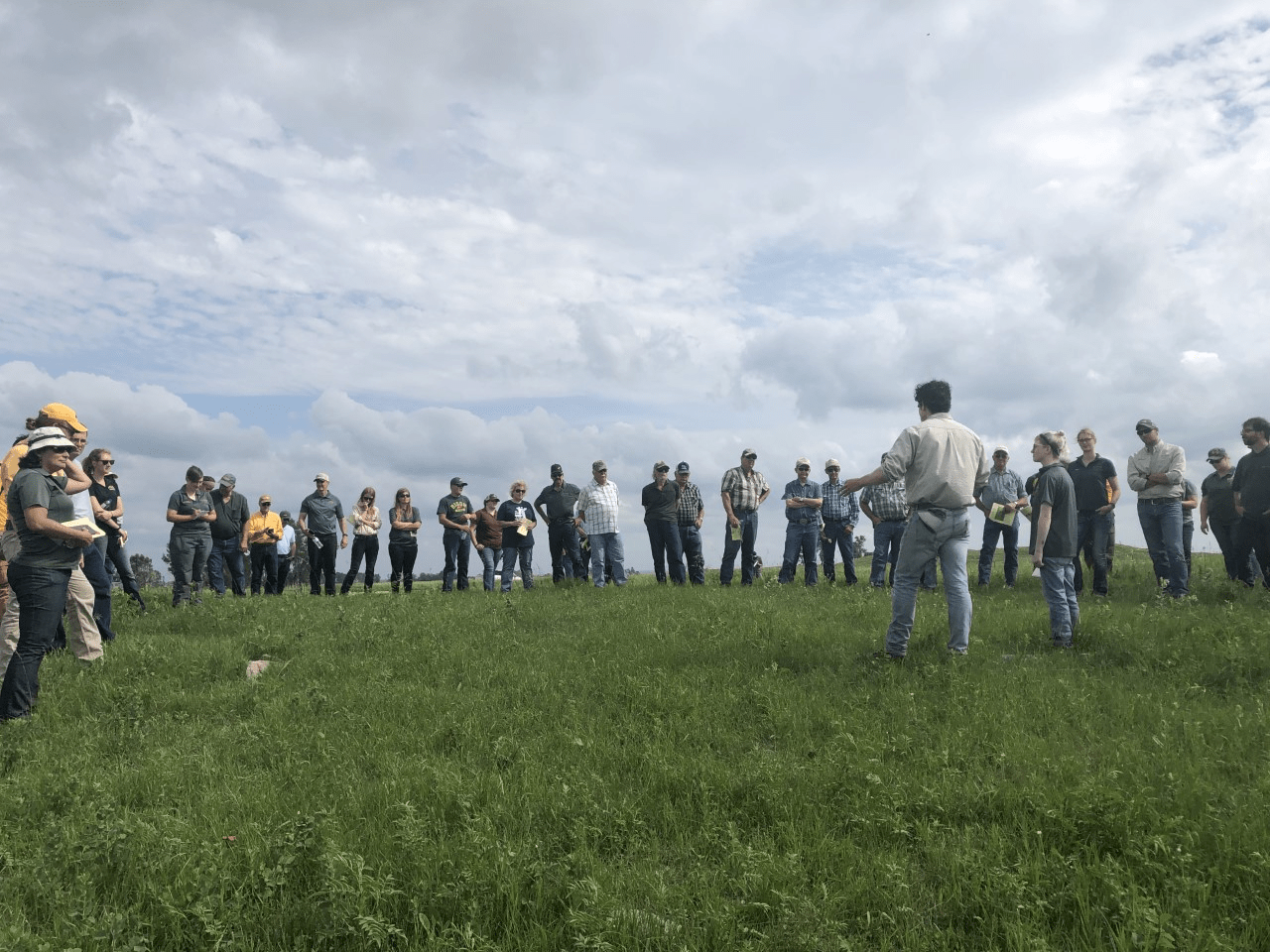 kevin-sedivec-director-of-the-central-grasslands-research-extension-center-talks-to-visitors-during-a-field-day-at-the-center-ndsu-photo