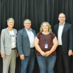 BEK Donation: L to R; Larry Robinson, left, Jill DeVries, second from left, Al LaFave, second from right and Cory Anderson, right at the Forward Together media event in July with BEK Communications Cooperative’s Brett Stroh, third from left and Judi Hintz, third from right.