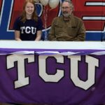 Signing: L to R; Katie Zaun and Maple Valley coach Dan Geurts.