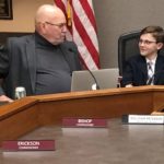 Mayor For A Day: L to R; Commissioner Mike Bishop visits with Sullivan Peterson before the meeting.