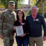 Award Ceremony: L to R; Col. Eric Swenson, Karen Kringlie, and Rich Schueneman.