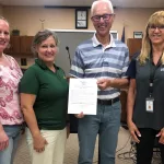 Proclaimation: Members of the Sheyenne Valley Healthy Brain Initiative L to R; Nikki Johnson, Sue Milender, Mayor Dave Carlsrud and Theresa Will.