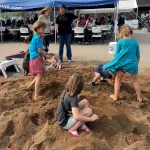 The Treasure Hunt: Kids have fun digging for treasures in the Smith Lumber Company 100th Anniversary.