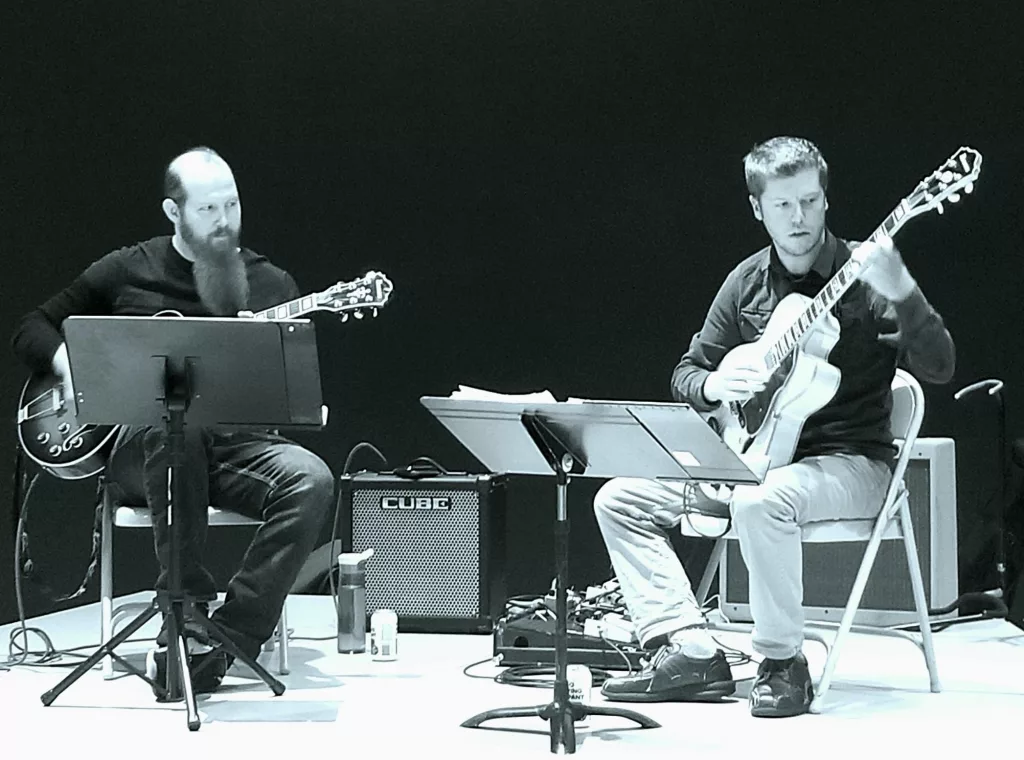 Twelve Strings Duo July 9th Pioneer Park Amphitheater - Vimarsana News