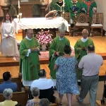 Church 2: Deb & Terry Olauson bring up the final offertory gifts.