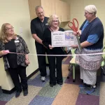 Ribbon Cutting: L to R; Library Director Anita Tulp, Jack and Diane Bjerke, and board president Hild van Gijssel.