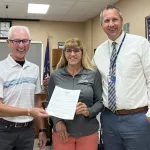 Awareness Week: Mayor Dave Carlsrud presents Theresa Will, CCHD Administrator and Josh Johnson, VCPS Superintendent with a signed copy of the City of Valley City proclamation.