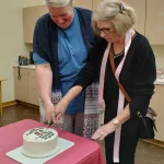 120th Celebration: L to R; Library board president Hilde van Gijssel and Diane Bjerke cut the 120th Birthday Cake on October 5th.