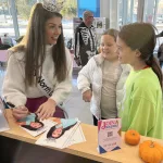 Trunk or Treat: Miss North Dakota Sydney Helgeson visits with these Valley City girls.