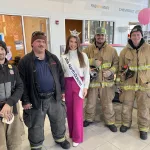 Trunk or Treat: Miss North Dakota Sydney Helgeson with Valley City firefighters at Puklich Chevrolet.