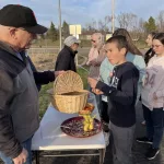 Crop Walk Three: Congregational and Epworth Churches reminded walkers that war is one of the biggest reasons there is hunger as they gave out fresh clementines and bananas, thanks to a generous donation from Thrivent.