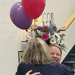 Sarah Lerud Surprised: Principal Kristi Brandt gives Sarah a hug after the surprise is sprung.