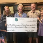 Check Presentation: L-R: Barb Lang, Paulette Ritter and Joan Morris, Community Foundation board members; Aaron Motter, Scout leader; Shirley Jackson, Jamestown Community Foundation board member.