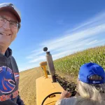 Plow Fest: Steve Urness riding along with Dave Johnson plowing with a Minneapolis Moline.