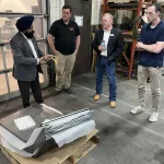 Malach USA Valley City: Far left: Param Chaddha, President of Malach gives a presentation and tour of the facility to representatives of the ND Development Fund, ND Economic Development and Finance (Division of ND Dept. of Commerce), and Advance Manufacturing Business Development Manager, David Lehman.