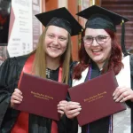 New Graduates: L to R; Jazmine Truax and Chloe Anderson celebrate after the ceremony.